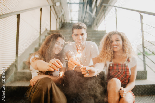 Friends with sparkles on steps photo