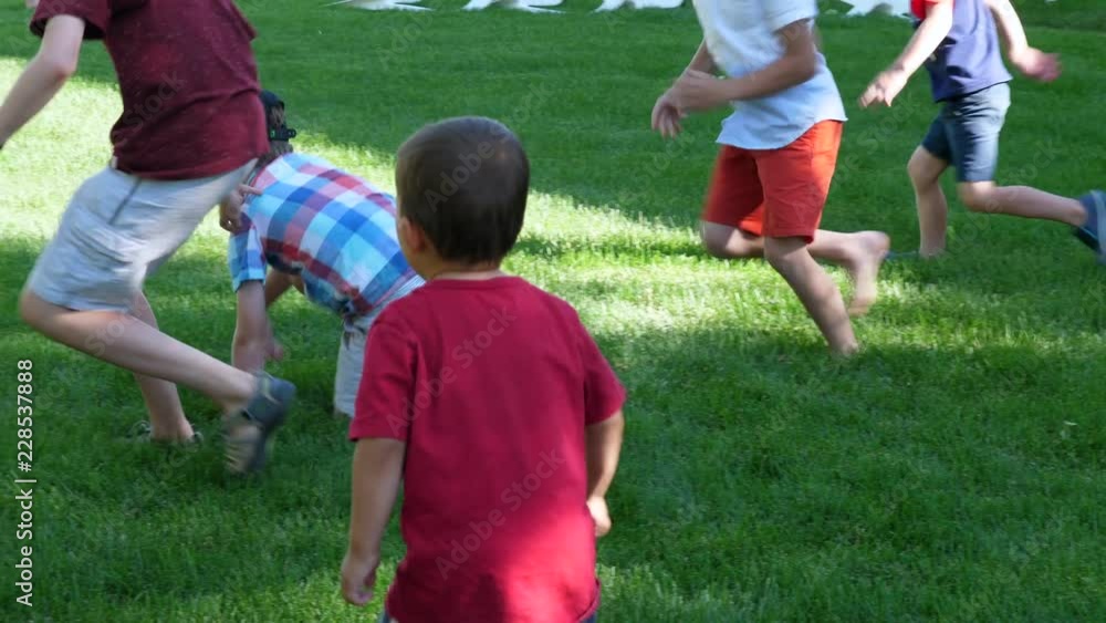 Children Chasing A Chicken At Family Party