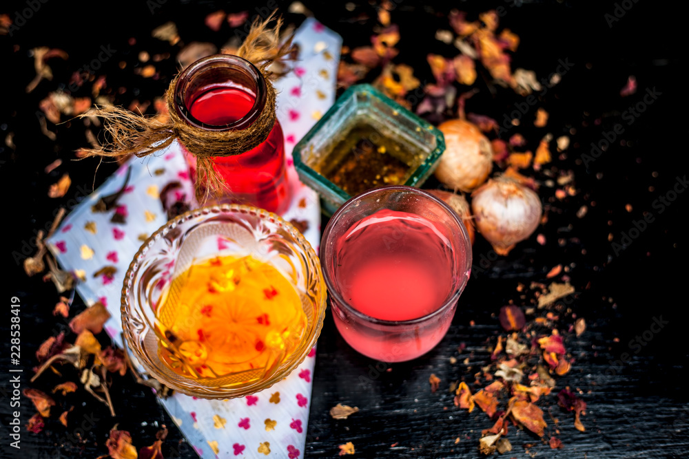 Home remedy for hair fall on wooden surface in glass bowl well mixed with  ingredients as rose water, raw onion juice and  up shot or top  shot. Stock Photo | Adobe