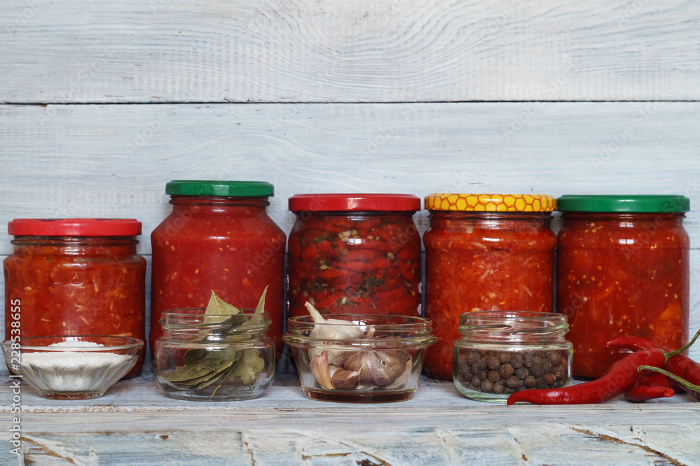 Glass jars with tinned vegetables and tomatoes Glass jars with tinned vegetables and tomatoes