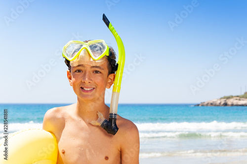 Portrait of happy teenage diver on the beach