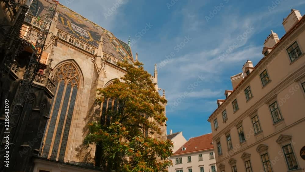 POV shot along the St. Stephens Cathedral in Vienna, Austria, a Romanesque and Gothic church completed in 1160 POV shot along the St. Stephens Cathedral in Vienna, Austria, a Romanesque and Gothic church completed in 1160