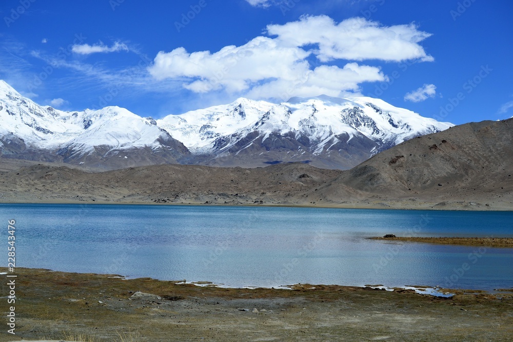 Karakul lake and pamir mountains in Xinjiang, Karakorum highway, China