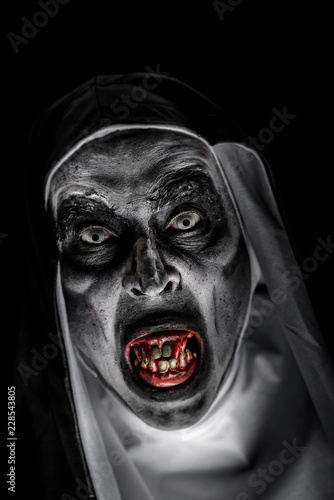 frightening evil nun with bloody teeth.
