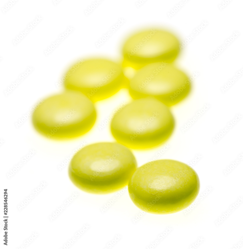 bottle of yellow medical valerian pills on a white background, herb medicine bottle of yellow medical valerian pills on a white background, herb medicine