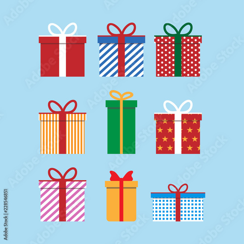 Set of colorful icons of gift boxes. Flat design for Christmas present, love valentine present on blue background. Vector illustration. photo