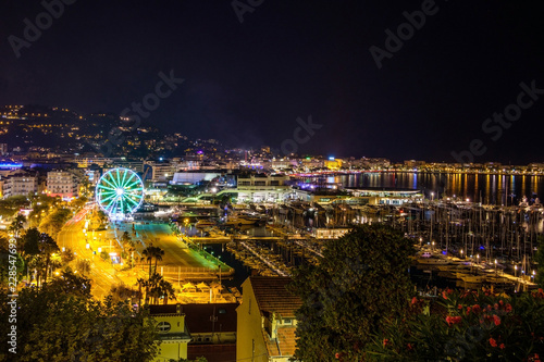 Illuminated city and port at night