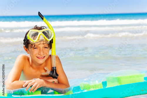 Young diver enjoying summer vacation on the beach