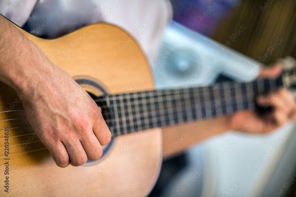 Fototapeta premium Man playing on guitar