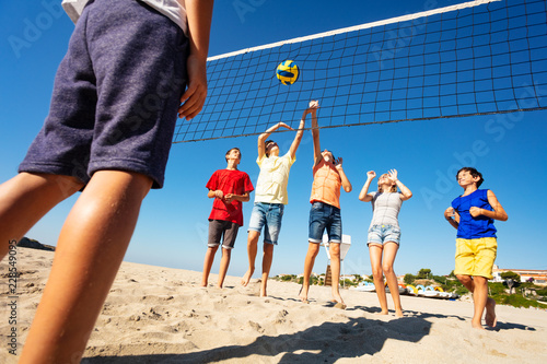 Volleyball players during match on the beach