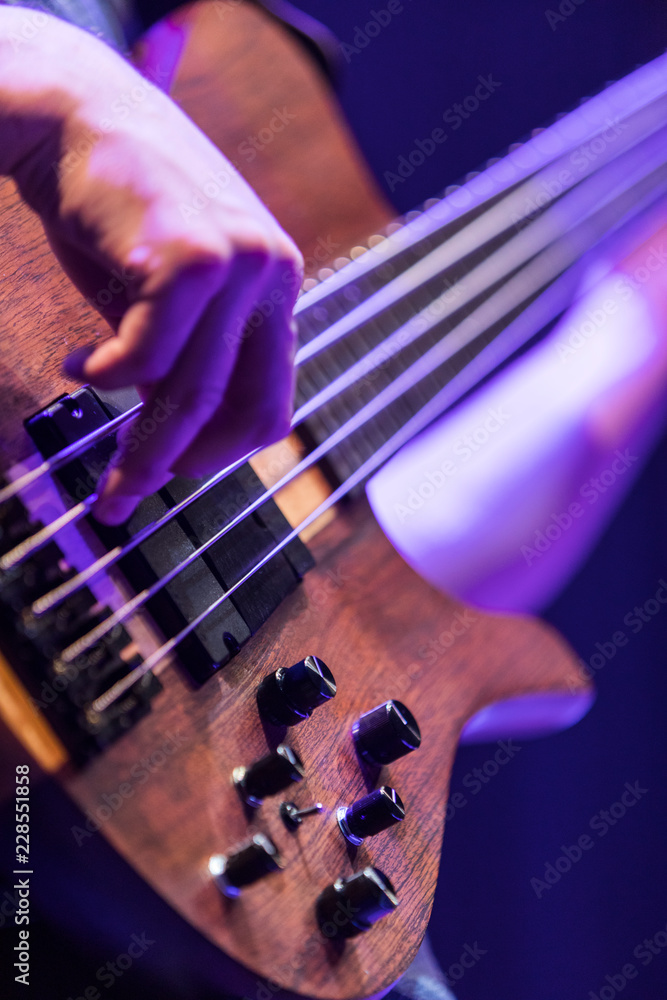 Fototapeta premium A base guitar player playing an electric base