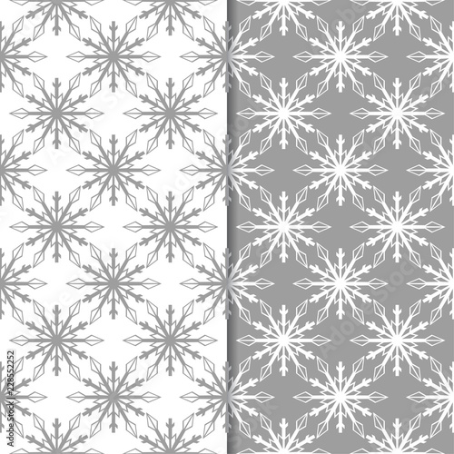 Snowflakes. Seamless patterns. Gray and white winter ornaments
