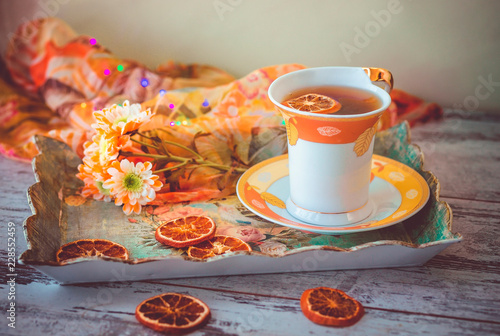 cup of tea with dried orange slices
