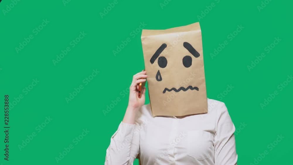 Crying Package concept of emotion, gestures. a man with a package on his head, with a ...