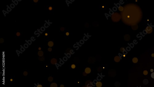 3D rendering of round particles of bright red and yellow fire sparks from ember floating upwards on black background 