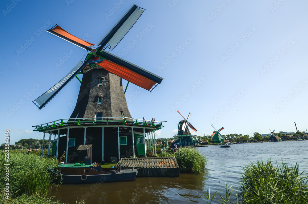 A country full of windmills and beautiful landscapes.