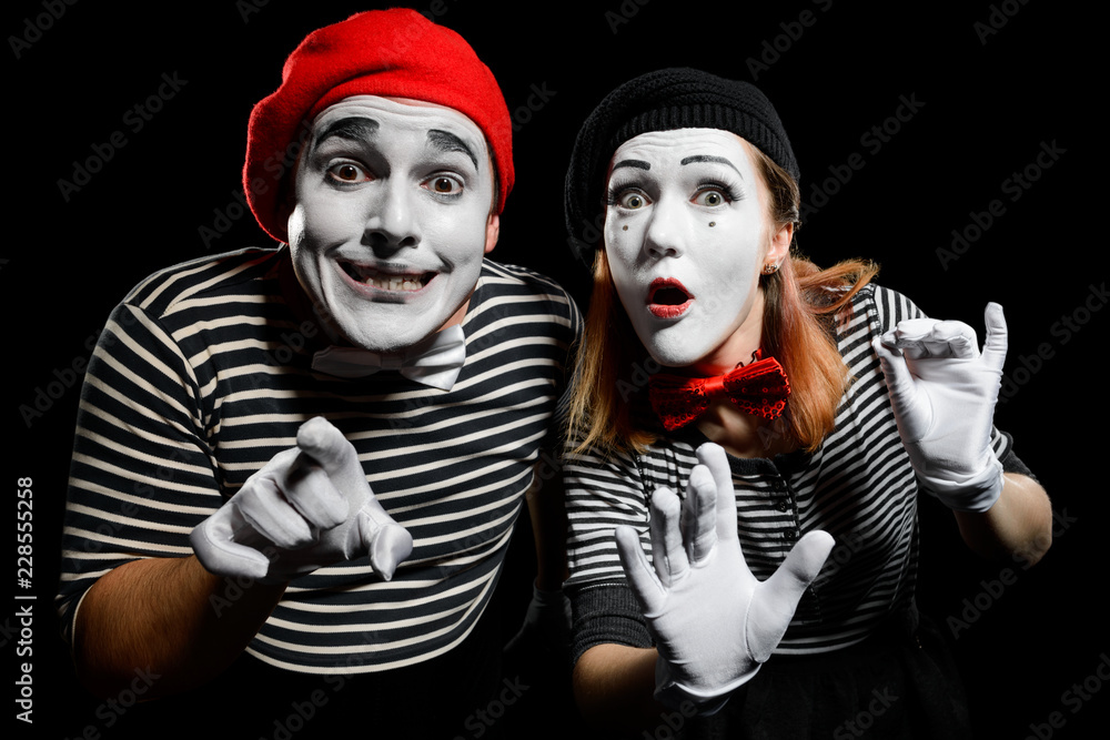 Curious mimes looking at camera Curious mimes looking at camera