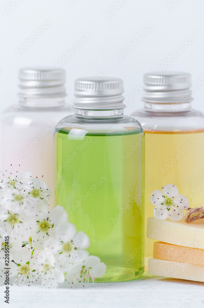 natural cosmetic bottles and soap bar with fresh flowers natural cosmetic bottles and soap bar with fresh flowers