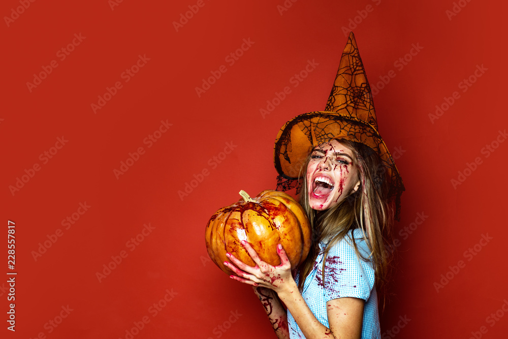 Gothic young woman in bloody witch halloween costume. Beauty Sexy