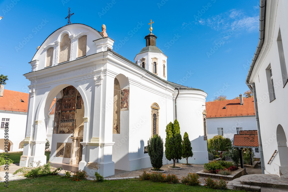a beautiful old Orthodox monastery located in a large park