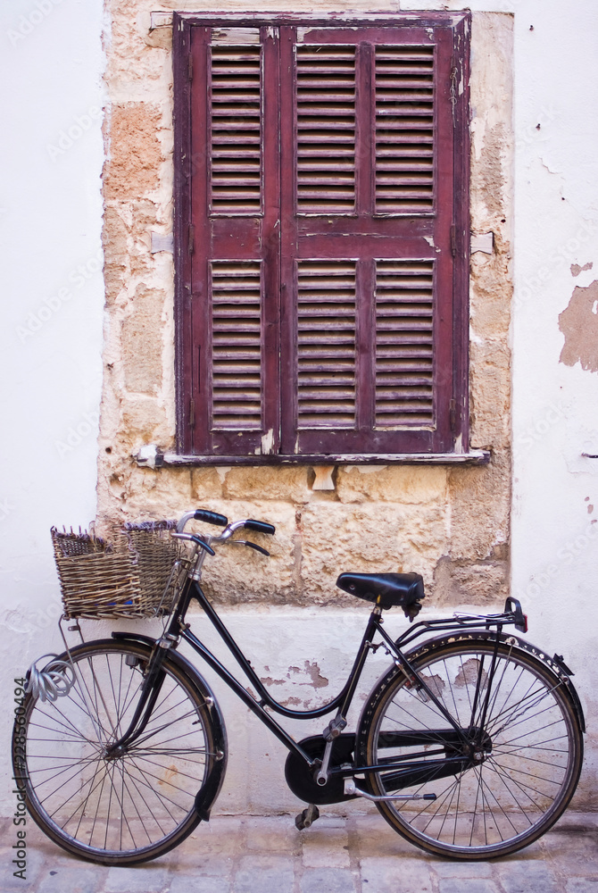 bicycle with basket at the street of old town.