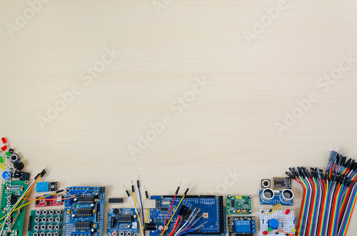 Form for a text in the form of a frame with electronic parts. Background of small electronic components. Free place for pasting text or writing title. Arduino