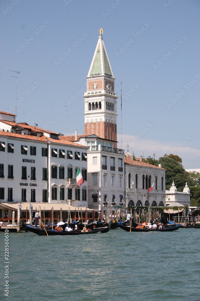 Gondola on canal in Venice, buildings in background Italy