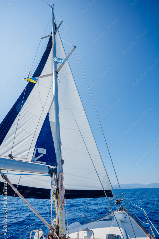 Sailing. Ship yachts with white sails in the open Sea. Sailing. Ship yachts with white sails in the open Sea.