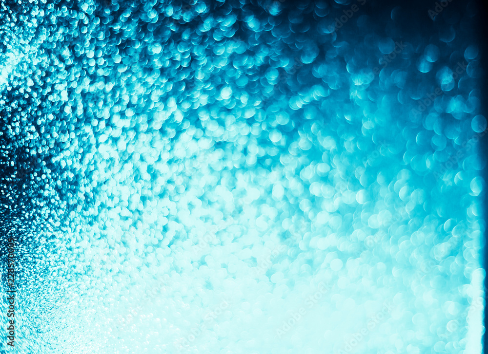 Obraz premium Abstract bokeh glitter background. Defocused background. Blurred bright light on black