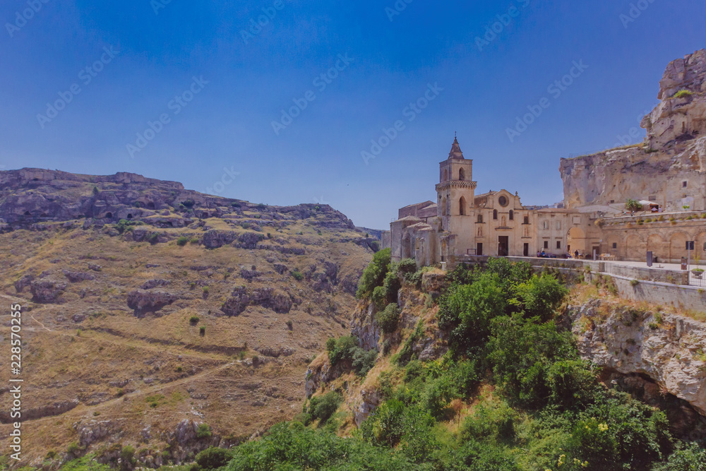 Church in the sassi of Matera, Italy and the valley and creek of the Murgia National Park