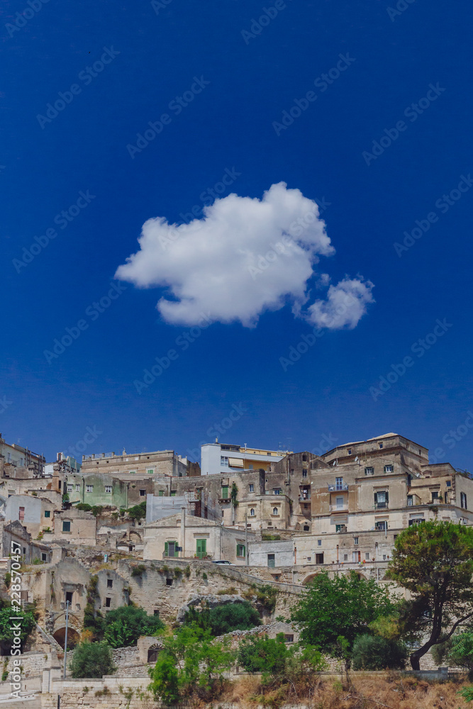 Sassi of Matera, Italy under blue sky and white cloud