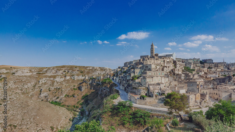 Fototapeta premium The sassi of Matera, Italy and the valley and creek of the Murgia National Park