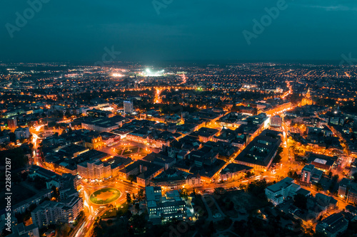 Old town Timisoara with beautiful city lights at blue hour - aerial view taken by a professional drone