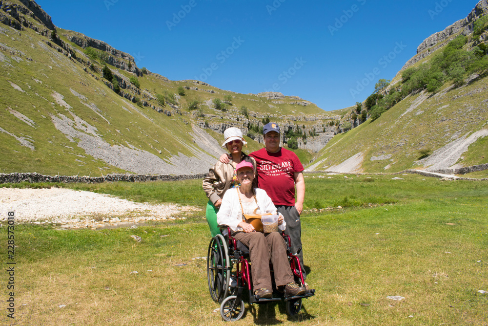 Disabled Female In Wheelchair and Carers Visting Gordale Scar