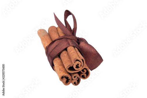 Cinnamon sticks with ribbon isolated on the white