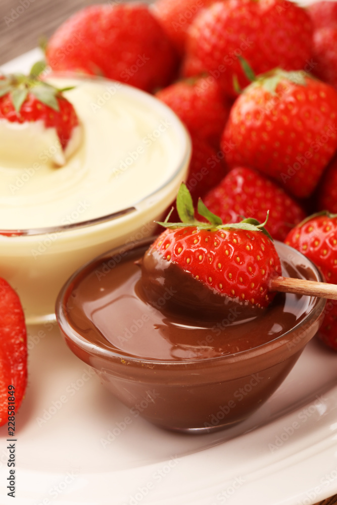 Fondue with Melting chocolate or melted chocolate and strawberry. Fondue with Melting chocolate or melted chocolate and strawberry.