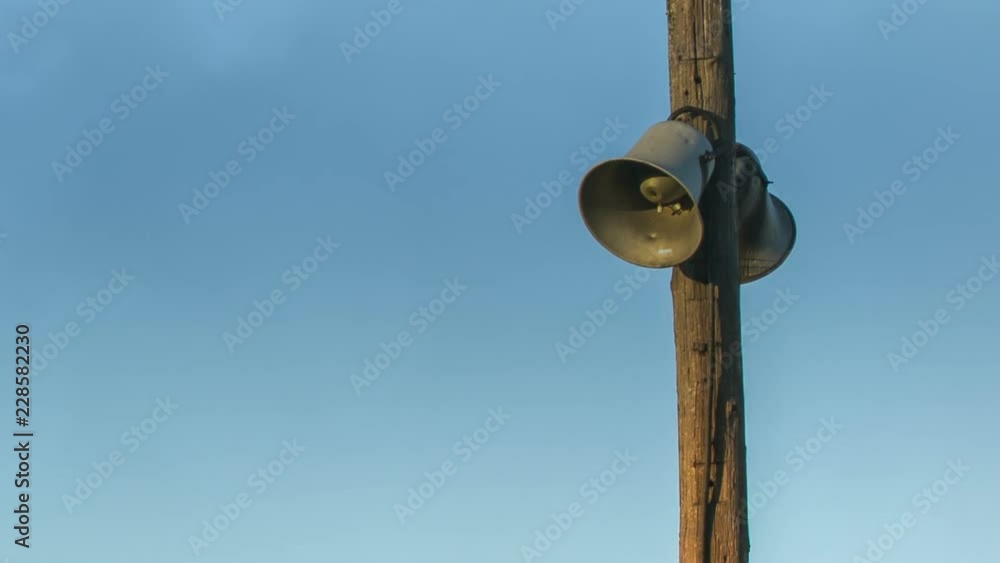 Public address horn loud speakers on wooden pole over blue sky. Magic Lantern Raw Video Public address horn loud speakers on wooden pole over blue sky. Magic Lantern Raw Video