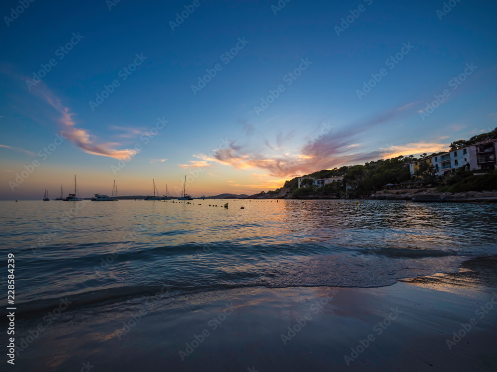 Beautiful sunset at Illetes Beach in Mallorca Spain