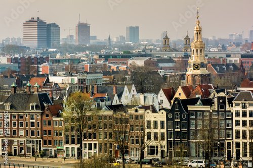 AMSTERDAM, NETHERLANDS - APRIL 10, 2018: Amsterdam skyline cityscape from the Oosterdok in the Netherlands. The Oosterdok is a chanel in Amsterdam .