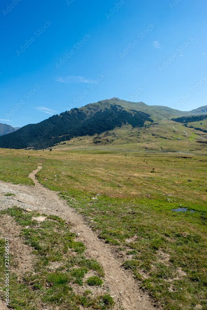 Fototapeta premium Mountains in Montgarri under blue sky, Valley of aran