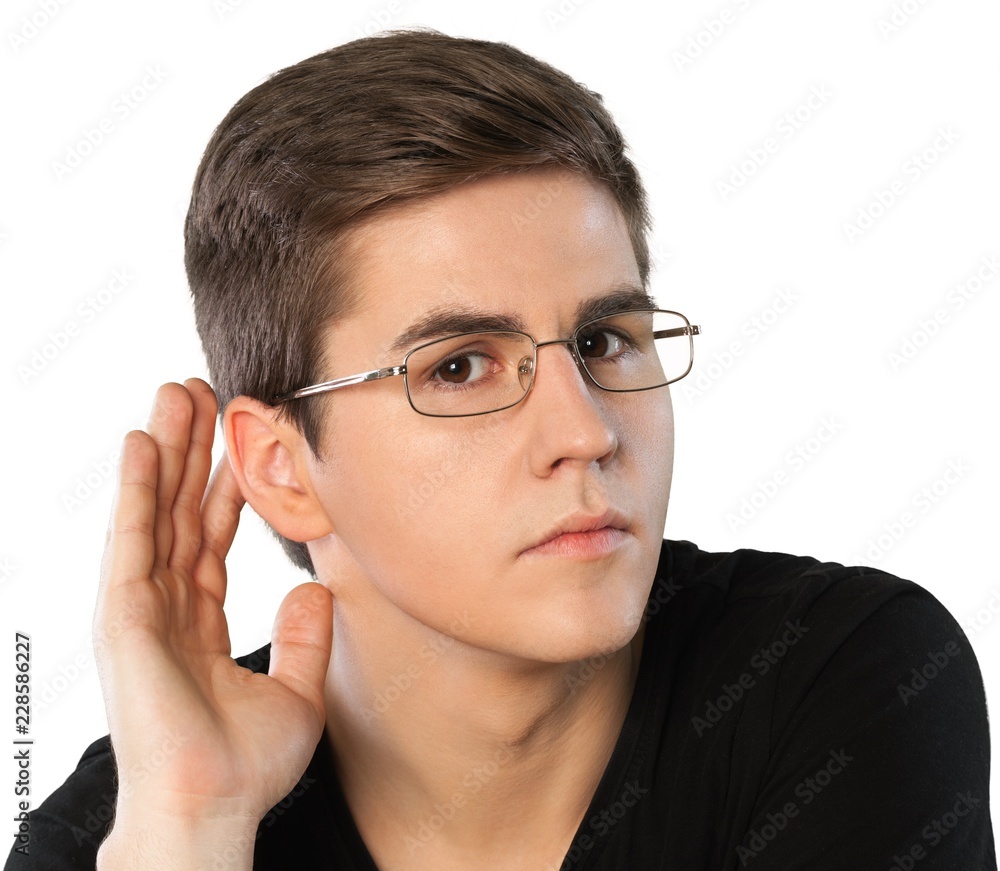 Serious Man with Glasses Hearing with Hand on Ear, Isolated Serious Man with Glasses Hearing with Hand on Ear, Isolated