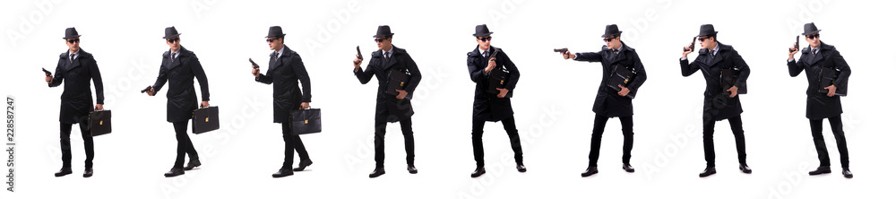 Man spy with handgun isolated on white background Man spy with handgun isolated on white background