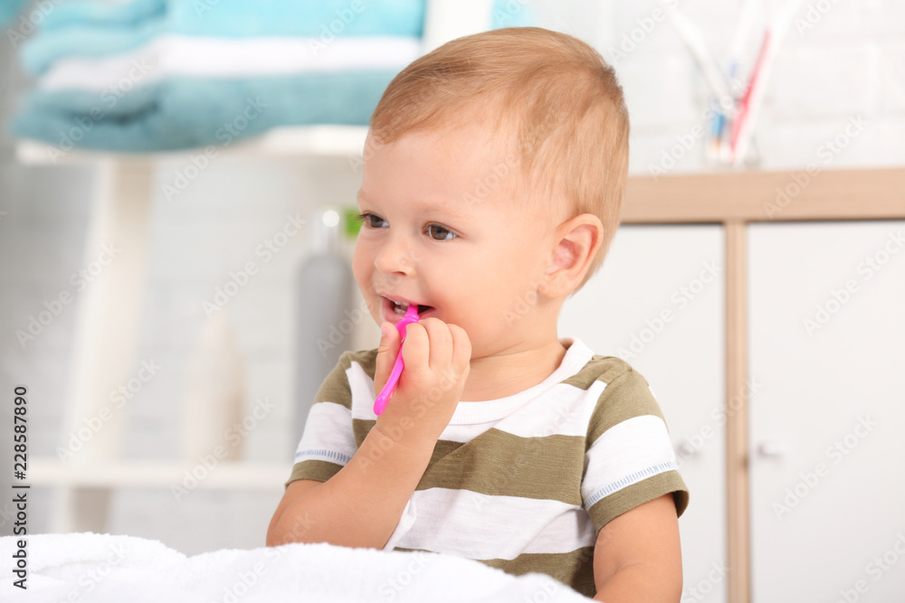 Cute little boy with toothbrush on blurred background Cute little boy with toothbrush on blurred background