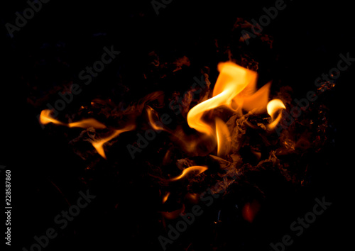 Hot fire flames in the dark. majestic fire at night. a special place on the stone. concept of ecology and use of fire outdoors in travel. used as background © donikz