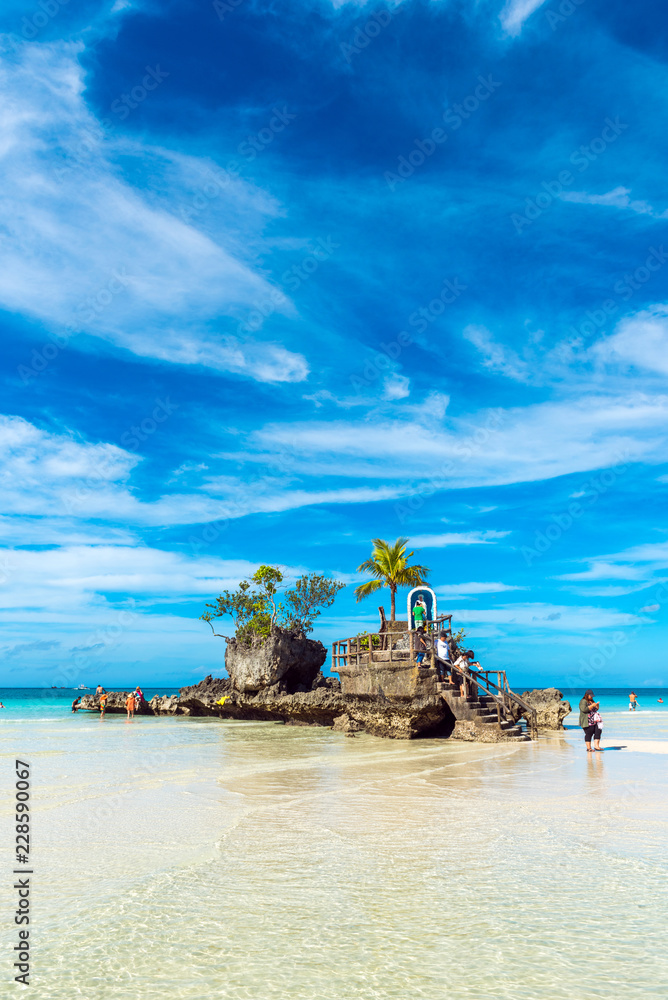 Fototapeta premium Willy's rock on the beach at Boracay, Philippines. Copy space for text. Vertical.