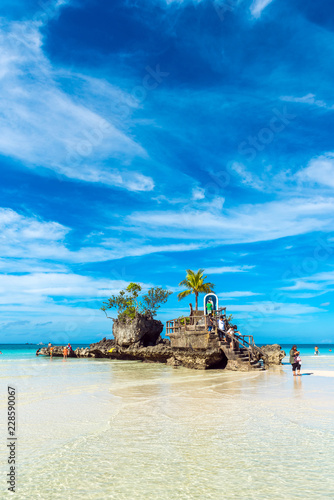 Willy's rock on the beach at Boracay, Philippines. Copy space for text. Vertical.
