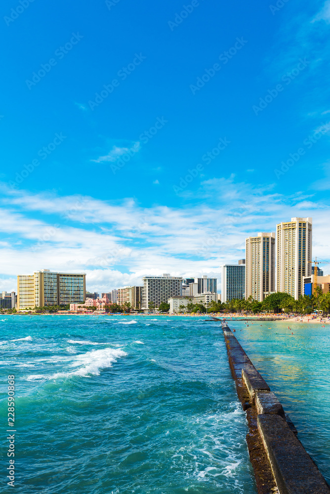 View of the Waikiki beach in Honolulu, Hawaii. Copy space for text. Vertical. View of the Waikiki beach in Honolulu, Hawaii. Copy space for text. Vertical.