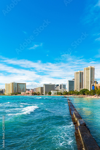 View of the Waikiki beach in Honolulu, Hawaii. Copy space for text. Vertical.