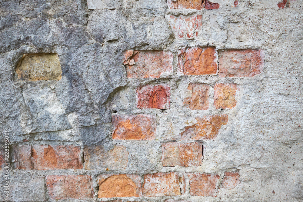 Fototapeta premium Red Textured Brick Wall With Damage Surface. Old Grunge Abstract Background.