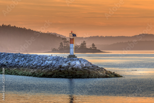 Small lighthouse with beautiful sunrise on north west coast © Kelly